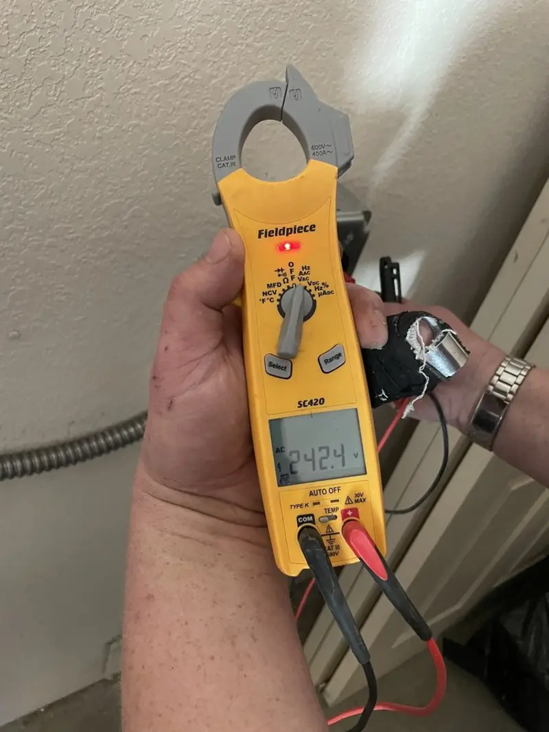 Voltage testing with clamp meter during Aluminum Wiring Replacement in Schriever